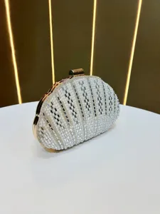Detail view of pearl rhinestone shell evening clutch bag, elegant design for party and wedding.