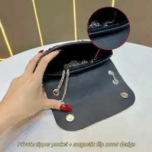 Rhinestone underarm bag interior detail, featuring chain strap and magnetic closure.
