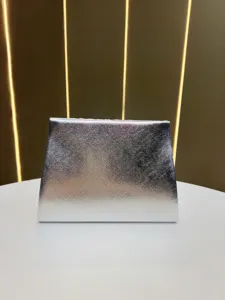 Silver metallic evening clutch bag, elegant shiny textured square purse for party and wedding events.