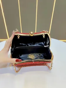Red crystal evening clutch bag with gold hardware, elegant chain handbag for women.