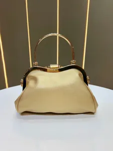 Elegant gold evening handbag with metal handle stylish clutch bag for women party dresses.