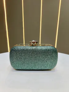 Exquisite glittering green evening clutch bag with crystal clasp detail for banquet dress events.