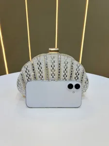 Pearl rhinestone shell clutch bag detail view, elegant evening bag with gold metal clasp.