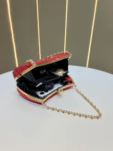 Red crystal clutch bag for women, elegant evening party shoulder bag with metal chain strap.