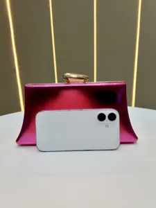 Pink metallic evening clutch bag detail view, stylish chic purse for women evening party use.