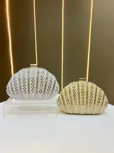 Pearl and diamond shell evening clutch bag detail view showcasing exquisite craftsmanship.