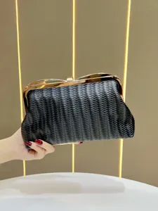 Black woven clutch evening bag with elegant gold kiss-lock frame and premium design for women.