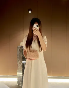 Elegant pearl rhinestone clutch bag detail view, luxurious evening handbag for women parties.