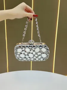Exquisite crystal evening clutch bag with sparkling rhinestones and metal chain for party.