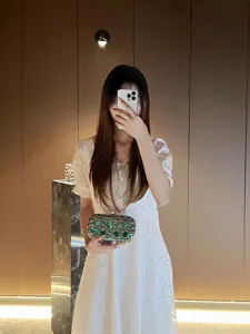 Elegant rhinestone evening clutch bag for women, luxury green gem party wedding handbag.