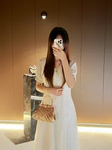 Elegant gold rhinestone evening handbag with metallic handle for women banquet party dress.