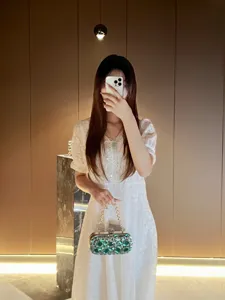 Exquisite rhinestone evening clutch bag with chain strap, perfect for banquet party dresses.