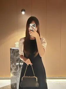 Elegant black evening clutch bag with gold chain strap, stylish design for parties and events.