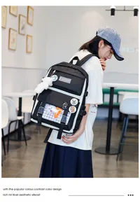 Canvas student school backpack with cute rabbit charm and contrast color design for daily use.