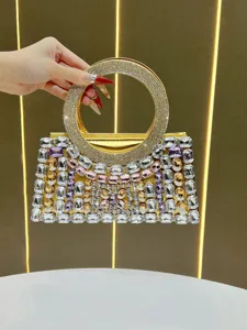 Luxury rhinestone evening bag detail, sparkling crystal handbag with circular handle.