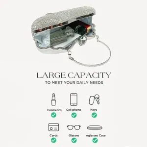 Silver rhinestone evening clutch bag with metal handle, elegant sparkling design for parties.