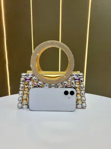 Golden rhinestone evening bag with round handle and colorful crystal embellishments for women.