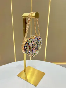 Heart-shaped rhinestone evening bag with gold chain strap, sparkling crystal handbag for parties.