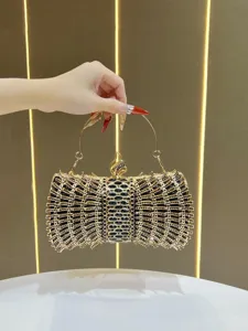 Exquisite crystal evening clutch bag detail, showcasing intricate rhinestone mesh and metal handle.