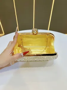 Elegant gold evening clutch bag for women featuring faux pearls and metal chain strap.