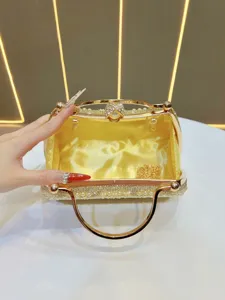 Stunning vintage rhinestone pearl evening clutch bag with metal handle and chain strap detail.