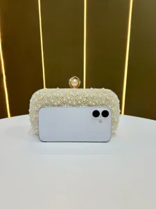 Elegant pearl evening bag clutch with delicate metal clasp for women party wedding daily use.