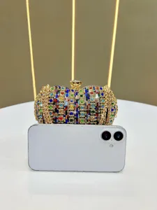 Luxurious crystal rhinestone evening clutch bag with gold chain, elegant crossbody handbag.
