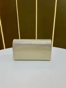 Elegant gold glitter evening clutch bag for women, perfect for parties and banquets.