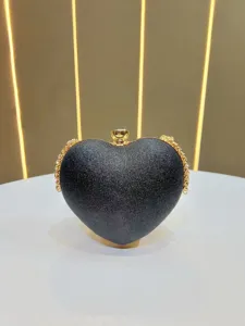 Elegant black glitter heart-shaped evening clutch bag with chic gold chain and clasp.