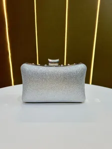 Silver glitter evening clutch bag with pearl decor, elegant shoulder handbag for party events.