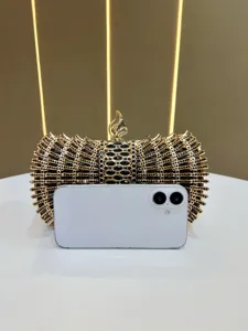 Elegant gold crystal evening clutch bag with exquisite metal frame for women banquet dress.
