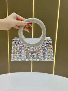 Rhinestone evening bag detail showcasing sparkling crystals and elegant circular handle.