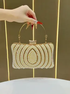 Exquisite pearl beaded evening clutch bag detail showing elegant metal handle and sparkling clasp.