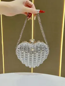 Sparkling crystal heart-shaped evening clutch bag with elegant chain strap for parties.