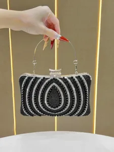 Detailed shot of elegant black beaded evening clutch bag with sparkling rhinestones and handle.
