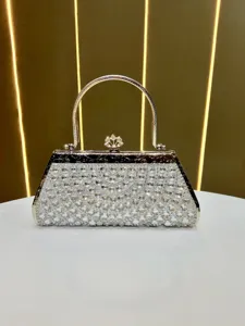 Rhinestone evening handbag with metallic handle and sparkling diamond crystals for party.