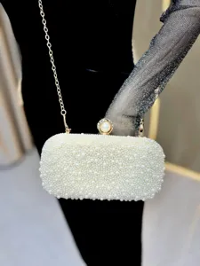 Elegant pearl evening clutch bag with metal chain strap, perfect for luxury party events.