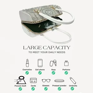 Detailed close-up view showing the rhinestone evening bag interior capacity and design.