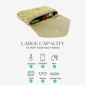 Pearl evening clutch bag interior capacity detail showing space for phone lipstick and keys.