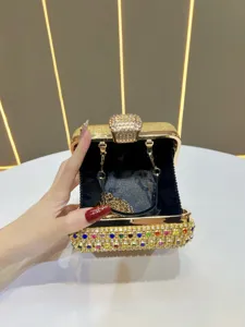 Gold rhinestone evening clutch bag with colorful crystals, luxury party minaudiere for women.