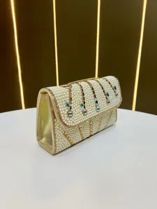 Detailed view of the elegant pearl rhinestone evening bag, showing exquisite beading and design.