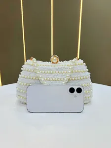 Elegant white pearl evening clutch bag with delicate bead handle and lace design for women.