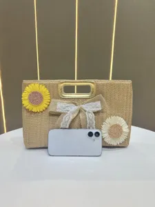 Stylish straw woven handbag with sunflower decor and lace bow for casual summer daily wear.