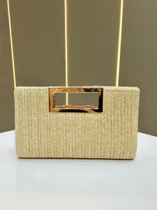 Woven straw clutch bag detail shot, elegant metallic rectangular handle, summer fashion accessory.