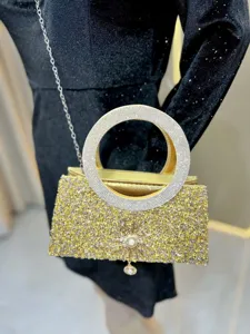 Luxury rhinestone evening bag with round handle, elegant chain crossbody bag for women detail.