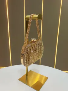 Gold rhinestone evening clutch bag with chain strap, luxury crystal clasp elegant crossbody bag.