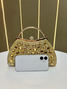 Stunning crystal evening clutch bag with metal handle, luxury rhinestone handbag for parties.