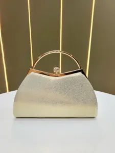 Luxury rhinestone evening clutch detail, elegant round handle metallic bag for women.