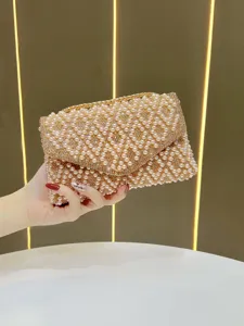 Exquisite pearl rhinestone evening clutch bag detail, elegant chain shoulder bag design.