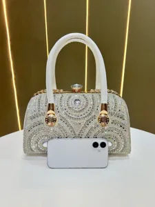 Luxury rhinestone evening bag for women, sparkly crystal clutch purse with top handle and gold hardware.
